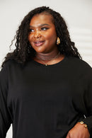 Haut à manches longues et col rond avec coutures doubles