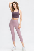 Leggings activos recortados con cintura ancha y bolsillos